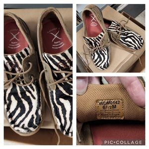 Twisted X Driving Moc with animal print.